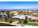 Beautiful waterfront property featuring a private dock and screened-in pool, situated in a charming neighborhood at 936 Lassino Ct, Punta Gorda, FL 33950