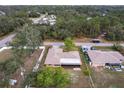 Aerial view of a home surrounded by lush trees and foliage in a tranquil neighborhood at 2281 Tolbert St, Port Charlotte, FL 33948