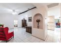 Bright living room showcasing tile flooring, a ceiling fan, and decorative architectural features at 2281 Tolbert St, Port Charlotte, FL 33948