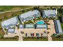 Aerial view of condo complex with pool, parking, and well-maintained landscaping at 1340 San Cristobal Ave # 305, Punta Gorda, FL 33983