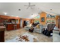 Open-concept living room featuring high ceilings, tile flooring, and access to the outdoor living space at 29175 River Dr, Punta Gorda, FL 33982