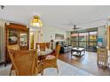 Open concept living and dining area with tile and wood floors and lots of natural light at 3006 Caring Way # 431, Port Charlotte, FL 33952
