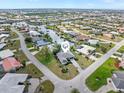 Aerial view of a property with waterfront access, surrounded by a network of canals and residential homes at 1301 Appian Dr, Punta Gorda, FL 33950