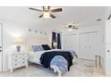 Bright bedroom with a queen bed, neutral rug, and double closets, creating a cozy and functional space at 1301 Appian Dr, Punta Gorda, FL 33950