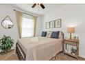 Cozy bedroom featuring a comfortable bed, ample natural light, and stylish decor at 25120 E Lenox Cir, Punta Gorda, FL 33950