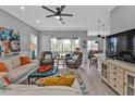 Beautifully decorated living room showcasing modern design, comfortable furniture, and ample natural light at 2892 Myakka Creek Ct, Port Charlotte, FL 33953