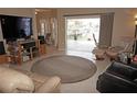 Open-concept living room with a seamless transition to a screened-in porch and a waterfront view at 379 Bal Harbor Blvd, Punta Gorda, FL 33950