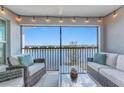 Relaxing screened-in patio featuring comfortable seating with lake view, perfect for enjoying outdoor living and serene surroundings at 14204 Heritage Landing Blvd # 724, Punta Gorda, FL 33955