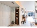 Open entryway with wood-look floors and views of the living area at 2040 Willow Hammock Cir # 208, Punta Gorda, FL 33983