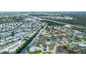 Community aerial shows canal-front homes with private docks, surrounded by lush greenery and convenient access to the city at 240 Riviera Ct, Punta Gorda, FL 33950