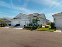 Charming single-story home with a well-maintained lawn and attached two-car garage at 24313 Westgate Blvd, Punta Gorda, FL 33980