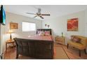 Comfortable bedroom with ceiling fan, window and furnishings creates a cozy, inviting atmosphere at 25225 Rampart Blvd # 1604, Punta Gorda, FL 33983