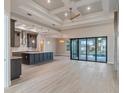 Spacious kitchen featuring a large island, stainless steel appliances, and an open view to the pool at 4320 Vasco St, Punta Gorda, FL 33950