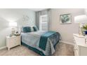 Cozy bedroom with a plush bed, stylish decor, and soft lighting, creating a relaxing retreat at 16395 Larocha Dr, Punta Gorda, FL 33955