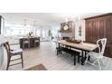 Bright, open living room with a brick fireplace, wood floors, and modern finishes at 18379 Meyer Ave, Port Charlotte, FL 33948