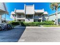 Condominium exterior with well-maintained landscaping and ample parking at 3233 Wood Thrush Dr # 23C, Punta Gorda, FL 33950