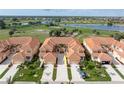Stunning aerial view of the condo complex, backing onto a lush golf course and serene lake at 3959 San Rocco Dr # 612, Punta Gorda, FL 33950