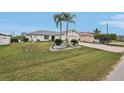 Attractive single-story home with a two-car garage, a wide driveway, and well-kept landscaping at 5244 Early Ter, Port Charlotte, FL 33981