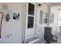 Comfortable screened porch with seating area, perfect for enjoying the outdoors at 5632 Holiday Park Blvd, North Port, FL 34287