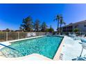 Community pool features a large open pool deck with plenty of seating at 5725 Greenwood Ave # 3104, North Port, FL 34287