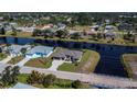 Wide aerial view of home on canal at 855 Rotonda Cir, Rotonda West, FL 33947