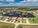 Expansive aerial view showcasing the home's location on a lake and near the ocean at 24362 Peppercorn Rd, Punta Gorda, FL 33955