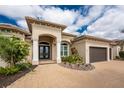 Beautifully landscaped home featuring a double-door entryway and neutral color scheme at 24362 Peppercorn Rd, Punta Gorda, FL 33955