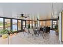 Inviting lanai features tile flooring, ceiling fans, and water views for ultimate relaxation at 611 Bal Harbor Blvd, Punta Gorda, FL 33950