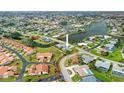 Panoramic aerial view showcasing the home's location within a beautiful waterfront community at 916 S Gondola Dr, Venice, FL 34293