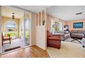Inviting living room featuring a large front picture window at 916 S Gondola Dr, Venice, FL 34293