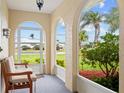 Relaxing screened patio with views of the lush yard at 916 S Gondola Dr, Venice, FL 34293