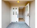 Bright entryway with a decorative glass front door and neutral tiled flooring at 931 Bal Harbor Blvd, Punta Gorda, FL 33950