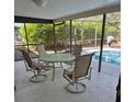 Outdoor seating and partial view of a refreshing swimming pool at 22480 Oceanside Ave, Port Charlotte, FL 33952
