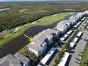 Aerial shot of the condo complex with waterfront views and golf course adjacent at 14081 Heritage Landing Blvd # 232, Punta Gorda, FL 33955