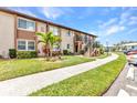 Charming home featuring well-maintained landscaping, a private entrance, and a welcoming pathway at 25100 Sandhill Blvd # R104, Punta Gorda, FL 33983