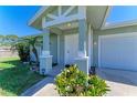 Charming single-story home featuring a well-manicured front yard and covered porch at 315 Southland Rd, Venice, FL 34293