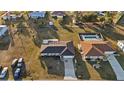 Aerial view of a single-Gathering home featuring a private backyard swimming pool at 3265 Sunrise Trl, Port Charlotte, FL 33952