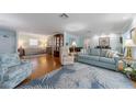 Spacious living room with hardwood floors, stylish furnishings, and lots of natural light at 5020 Brittany S Dr # 324, St Petersburg, FL 33715