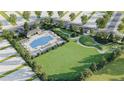 Aerial view of community pool and lounge area, set amidst lush landscaping and mature trees at 9519 Turtle Grass Cir, Punta Gorda, FL 33950