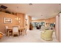 Spacious and open living area with neutral decor and a view to an adjacent room at 10488 Princess Ct, Punta Gorda, FL 33955