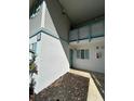 Condo exterior entrance with painted door and matching shutters provides a welcome at 1051 Forrest Nelson Blvd # M 103, Port Charlotte, FL 33952