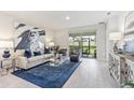 The Living room features stylish furniture, modern decor, and plenty of natural light at 16408 Bridle Ridge St, Port Charlotte, FL 33953