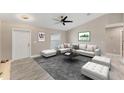 Cozy living room featuring neutral colors, comfortable seating, and modern decor at 3841 Cinderella Rd, North Port, FL 34286
