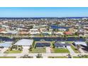 Scenic aerial view of waterfront homes with canals and beautiful blue waters at 430 Capri Isles Ct, Punta Gorda, FL 33950