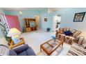 Cozy living room featuring tile flooring and an open layout at 7534 Carissa, Punta Gorda, FL 33955