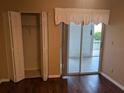 Bedroom showcasing a closet and a sliding glass door to the patio at 1340 San Cristobal Ave # 207, Punta Gorda, FL 33983