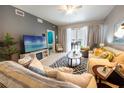 Cozy living room features tiled flooring, neutral walls, and comfortable seating at 2002 Bal Harbor Blvd # 311, Punta Gorda, FL 33950