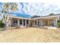 Charming single-story home with a covered entrance and a two-car carport surrounded by well-kept landscaping at 231 Winson Ave, Englewood, FL 34223