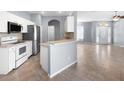 Modern kitchen featuring stainless steel appliances, ample cabinet space and an open design at 6938 Rabbit Ave, North Port, FL 34291