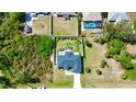 Aerial view of the property showcasing the home, surrounding land, and neighborhood at 7243 Patricia Pl, Englewood, FL 34224